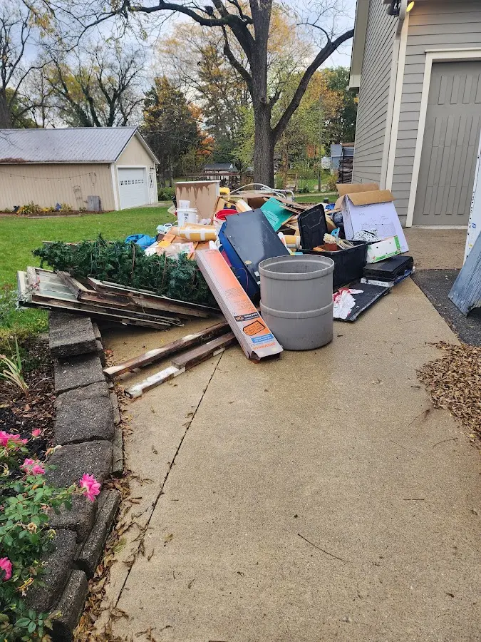 Dumpster being loaded with debris for Residential Dumpster Rental in Freeburg